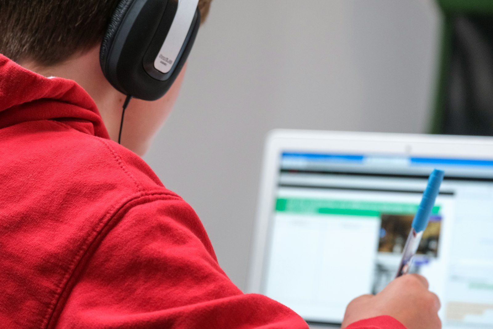 Student using laptop in classroom