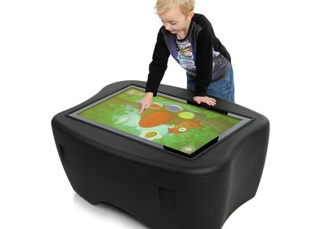 Boy playing with interactive screen
